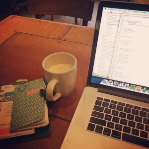 Coffee, a laptop, and notebooks: recipe for happiness